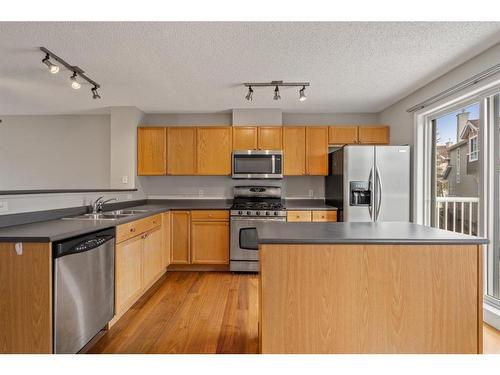 161 Tuscany Court Nw, Calgary, AB - Indoor Photo Showing Kitchen With Stainless Steel Kitchen With Double Sink