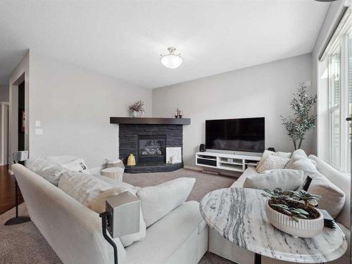 540 Auburn Bay Drive Se, Calgary, AB - Indoor Photo Showing Living Room With Fireplace