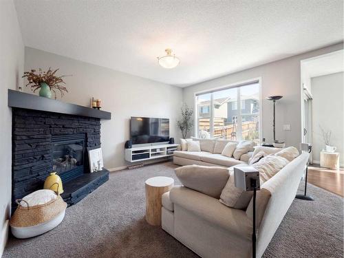 540 Auburn Bay Drive Se, Calgary, AB - Indoor Photo Showing Living Room With Fireplace