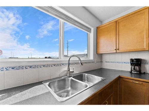 166 Cramond Circle Se, Calgary, AB - Indoor Photo Showing Kitchen With Double Sink