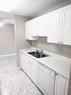 406-30 Mchugh Court Ne, Calgary, AB  - Indoor Photo Showing Kitchen With Double Sink 