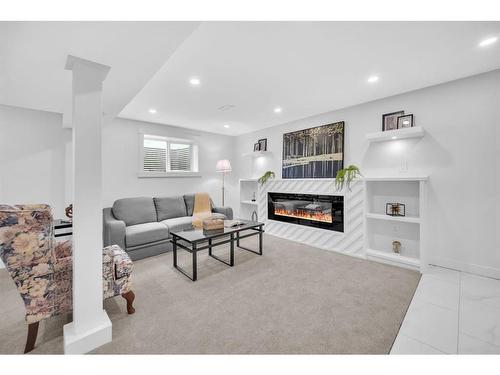 908 87 Avenue Sw, Calgary, AB - Indoor Photo Showing Living Room With Fireplace
