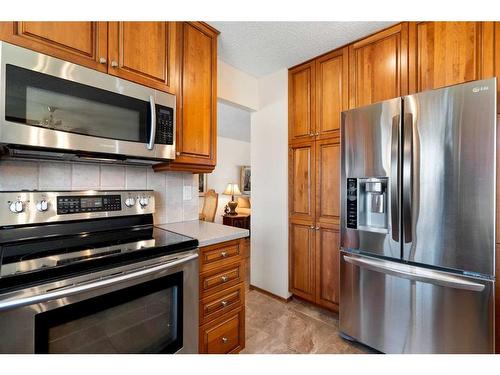 239 Parkland Crescent Se, Calgary, AB - Indoor Photo Showing Kitchen With Stainless Steel Kitchen
