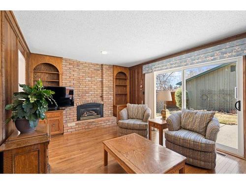 239 Parkland Crescent Se, Calgary, AB - Indoor Photo Showing Living Room With Fireplace