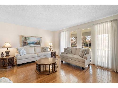 239 Parkland Crescent Se, Calgary, AB - Indoor Photo Showing Living Room