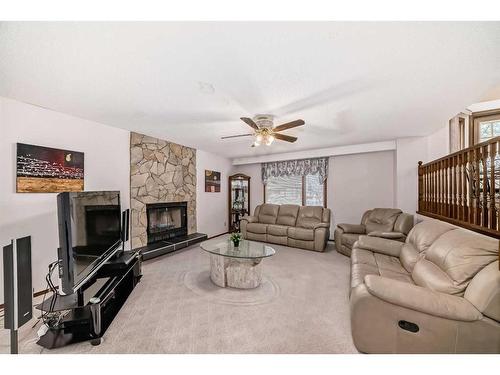132 Whitlow Place Ne, Calgary, AB - Indoor Photo Showing Living Room With Fireplace