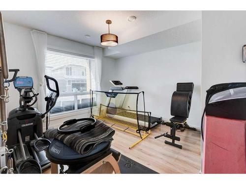 215-7820 Spring Willow Drive Sw, Calgary, AB - Indoor Photo Showing Gym Room