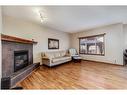 169 Brightonstone Landing Se, Calgary, AB  - Indoor Photo Showing Living Room With Fireplace 