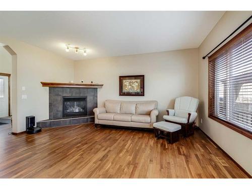 169 Brightonstone Landing Se, Calgary, AB - Indoor Photo Showing Living Room With Fireplace