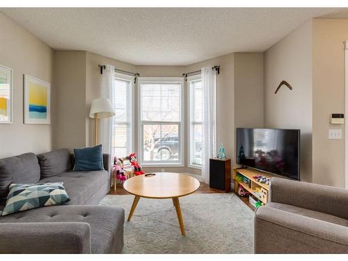 92 Tuscany Springs Way Nw, Calgary, AB - Indoor Photo Showing Living Room