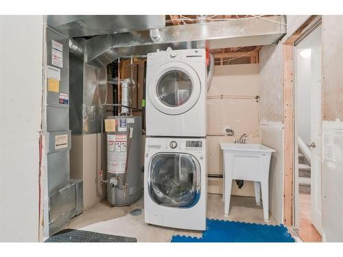 87 Arbour Meadows Close Nw, Calgary, AB - Indoor Photo Showing Laundry Room