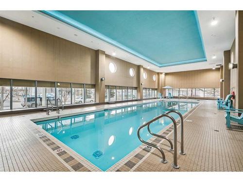 703-55 Spruce Place Sw, Calgary, AB - Indoor Photo Showing Other Room With In Ground Pool