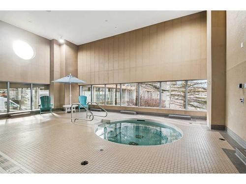 703-55 Spruce Place Sw, Calgary, AB - Indoor Photo Showing Other Room With In Ground Pool