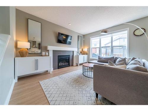 186 Chaparral Valley Way Se, Calgary, AB - Indoor Photo Showing Living Room With Fireplace