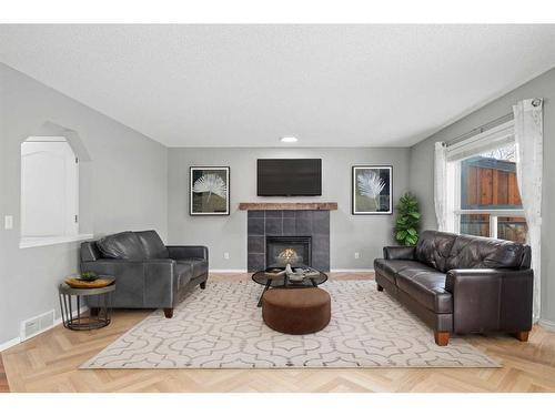 543 Douglas Glen Boulevard Se, Calgary, AB - Indoor Photo Showing Living Room With Fireplace