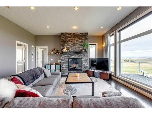 434196 Clear Mountain Drive East, Rural Foothills County, AB - Indoor Photo Showing Living Room With Fireplace