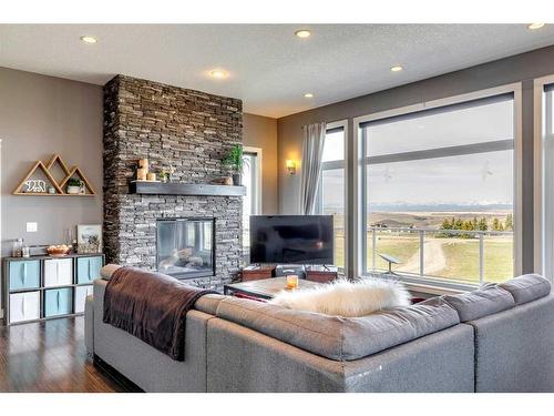 434196 Clear Mountain Drive East, Rural Foothills County, AB - Indoor Photo Showing Living Room With Fireplace