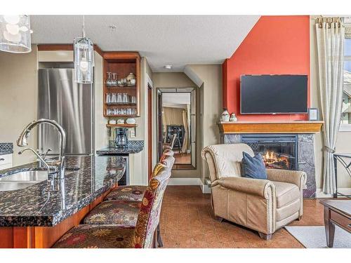 306-173 Kananaskis Way, Canmore, AB - Indoor With Fireplace