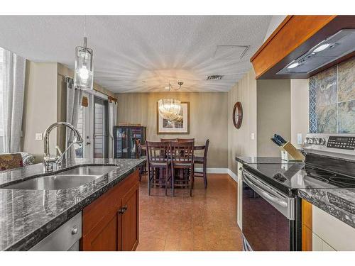 306-173 Kananaskis Way, Canmore, AB - Indoor Photo Showing Kitchen With Double Sink