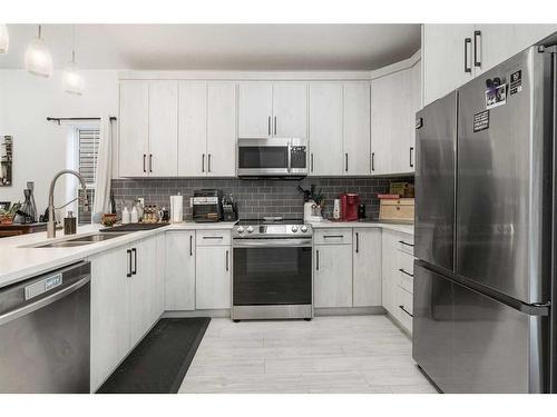 805-2001 Luxstone Boulevard Sw, Airdrie, AB - Indoor Photo Showing Kitchen With Double Sink With Upgraded Kitchen