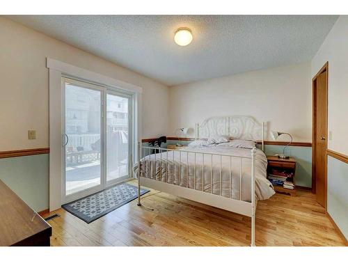 253 Arbour Cliff Close Nw, Calgary, AB - Indoor Photo Showing Bedroom