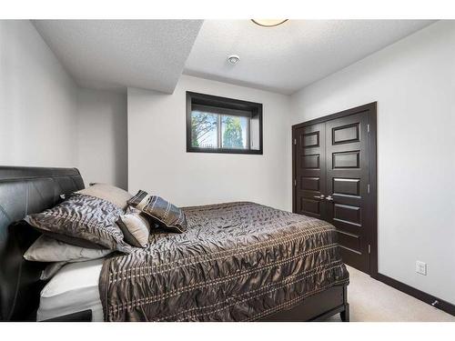 100 Waterside Court, Rural Rocky View County, AB - Indoor Photo Showing Bedroom