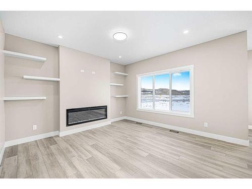 506 Clydesdale Way, Cochrane, AB - Indoor With Fireplace