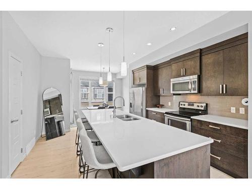256 New Brighton Walk Se, Calgary, AB - Indoor Photo Showing Kitchen With Stainless Steel Kitchen With Double Sink With Upgraded Kitchen
