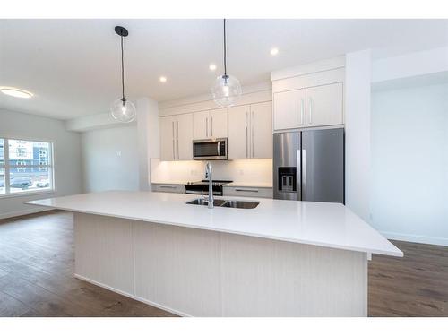 132 Merganser Drive W, Chestermere, AB - Indoor Photo Showing Kitchen With Double Sink With Upgraded Kitchen