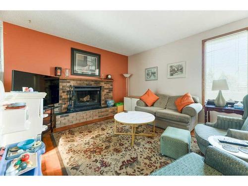 41 Sunhaven Close Se, Calgary, AB - Indoor Photo Showing Living Room With Fireplace