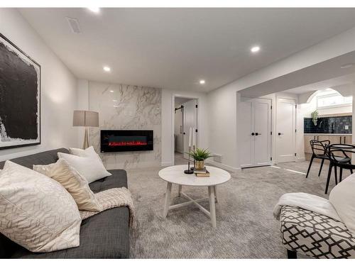 5355 Lakeview Drive Sw, Calgary, AB - Indoor Photo Showing Living Room With Fireplace