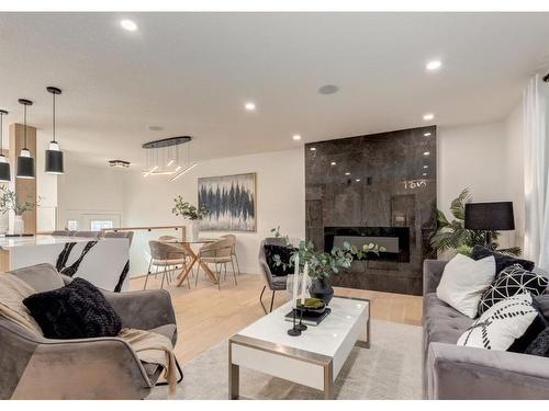 5355 Lakeview Drive Sw, Calgary, AB - Indoor Photo Showing Living Room With Fireplace