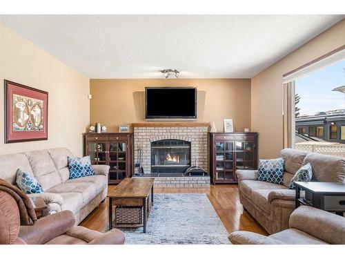 153 Scanlon Hill Nw, Calgary, AB - Indoor Photo Showing Living Room With Fireplace