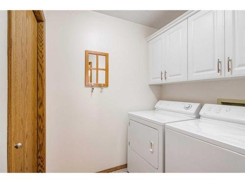 153 Scanlon Hill Nw, Calgary, AB - Indoor Photo Showing Laundry Room
