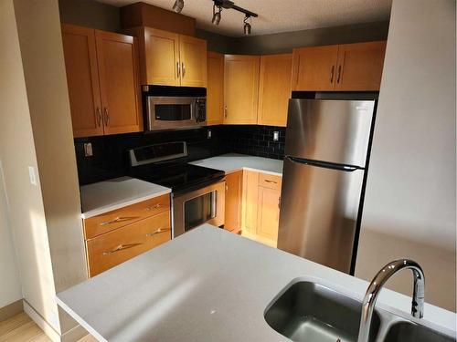 3107-5605 Henwood Street Sw, Calgary, AB - Indoor Photo Showing Kitchen With Double Sink