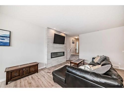 23 Walgrove Link Se, Calgary, AB - Indoor Photo Showing Living Room With Fireplace