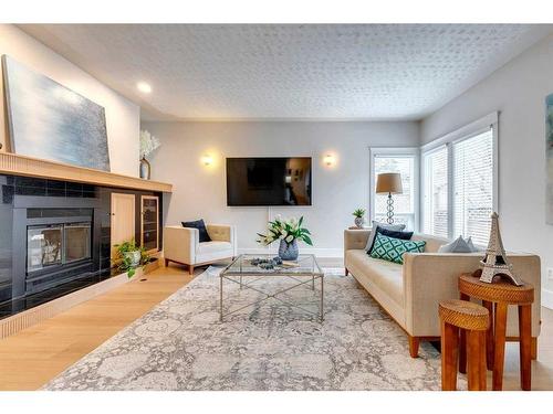 210 Canova Close Sw, Calgary, AB - Indoor Photo Showing Living Room With Fireplace