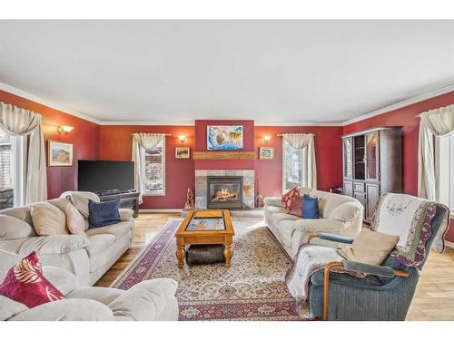 48068 244 Avenue West, Rural Foothills County, AB - Indoor Photo Showing Living Room With Fireplace