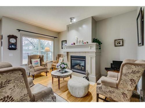 63 Wentworth Common Sw, Calgary, AB - Indoor Photo Showing Living Room With Fireplace