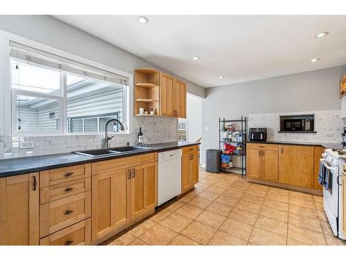 4407 46 Avenue Sw, Calgary, AB - Indoor Photo Showing Kitchen With Double Sink