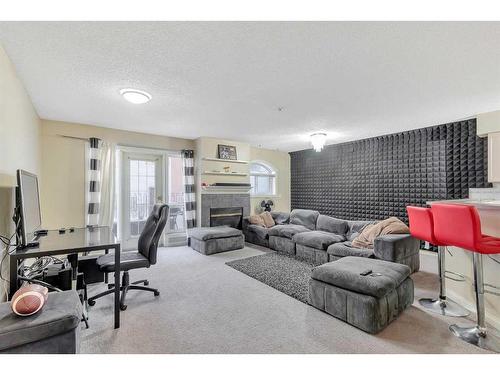 109-923 15 Avenue Sw, Calgary, AB - Indoor With Fireplace