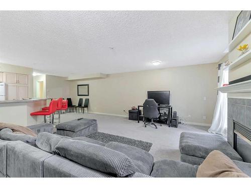 109-923 15 Avenue Sw, Calgary, AB - Indoor Photo Showing Other Room With Fireplace
