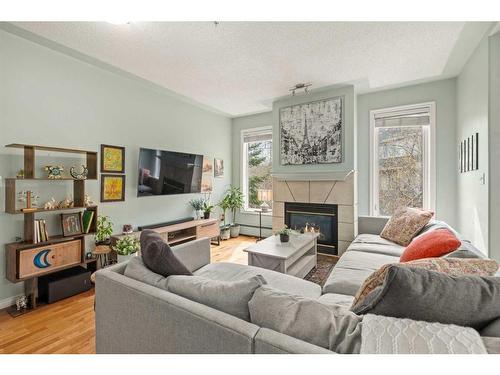 301-2419 Erlton Road Sw, Calgary, AB - Indoor Photo Showing Living Room With Fireplace