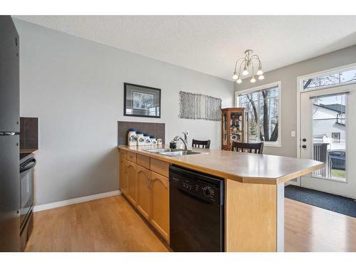 162 Everridge Gardens Sw, Calgary, AB - Indoor Photo Showing Kitchen With Double Sink