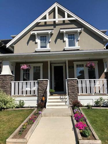 310 Cooperstown Common Sw, Airdrie, AB - Outdoor With Deck Patio Veranda With Facade
