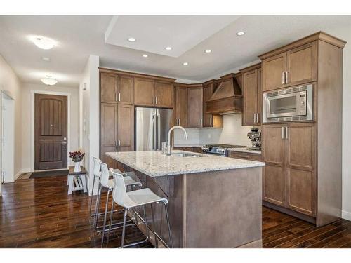310 Cooperstown Common Sw, Airdrie, AB - Indoor Photo Showing Kitchen With Upgraded Kitchen