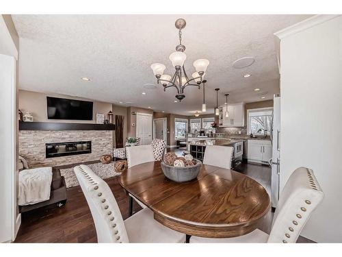 15218 Prestwick Boulevard Se, Calgary, AB - Indoor Photo Showing Dining Room With Fireplace