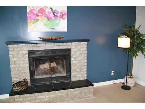 10 Centre Street, Strathmore, AB - Indoor Photo Showing Living Room With Fireplace
