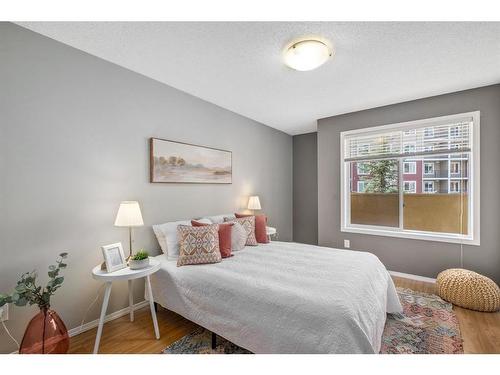 2130-700 Willowbrook Road Nw, Airdrie, AB - Indoor Photo Showing Bedroom