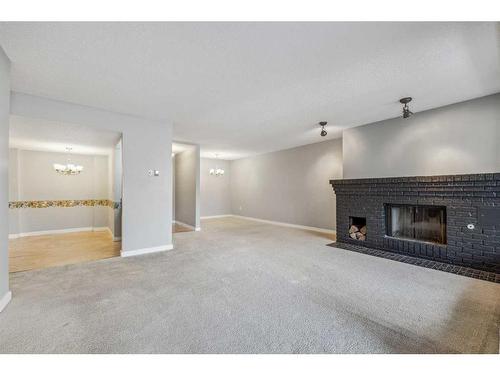 203-2425 90 Avenue Sw, Calgary, AB - Indoor With Fireplace